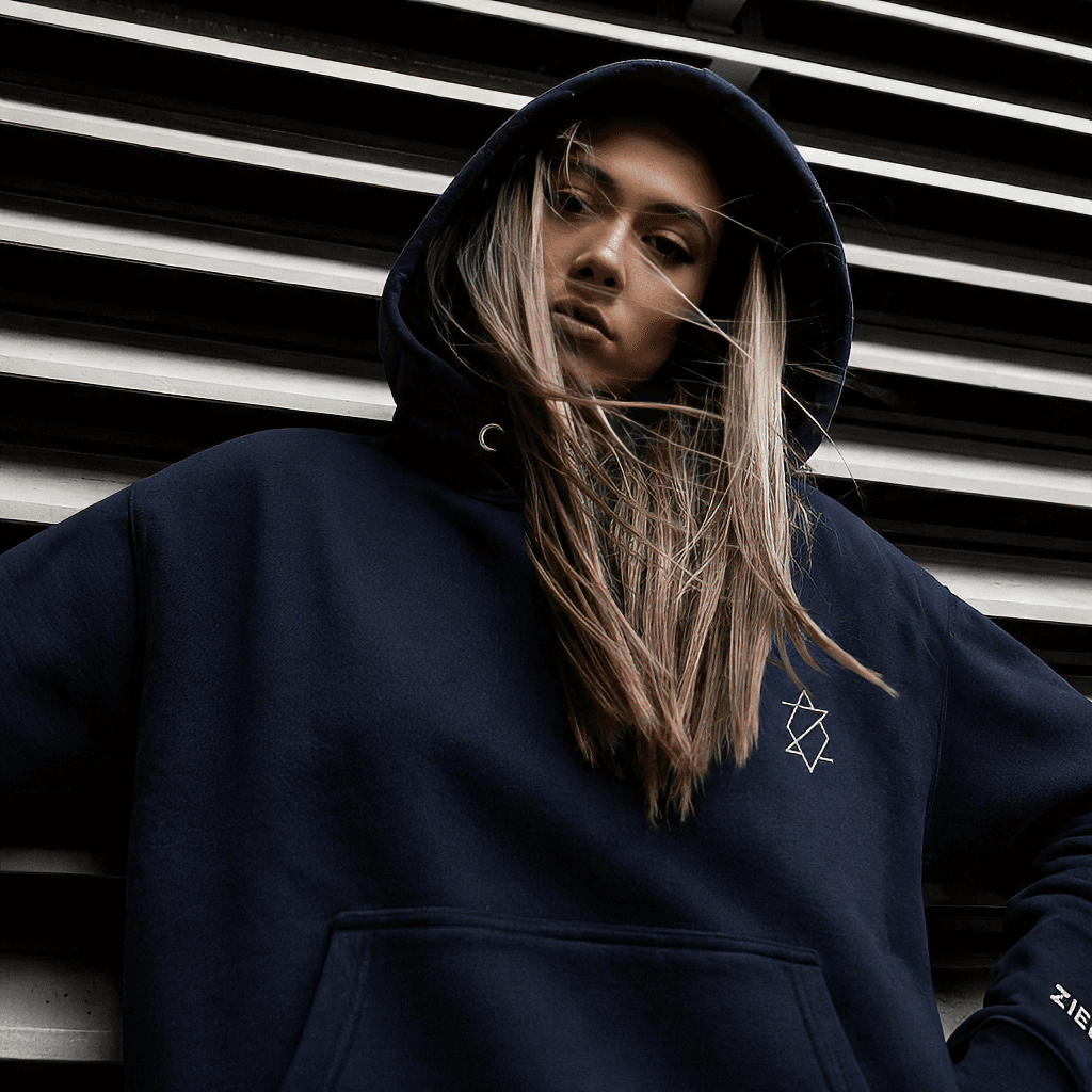 Editorial close-up of a black Zieck hoodie